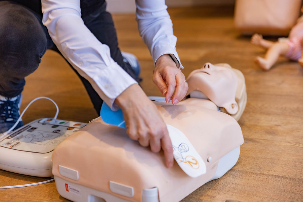 How to place AED on patient first aid training in West London. Emergency first aid.